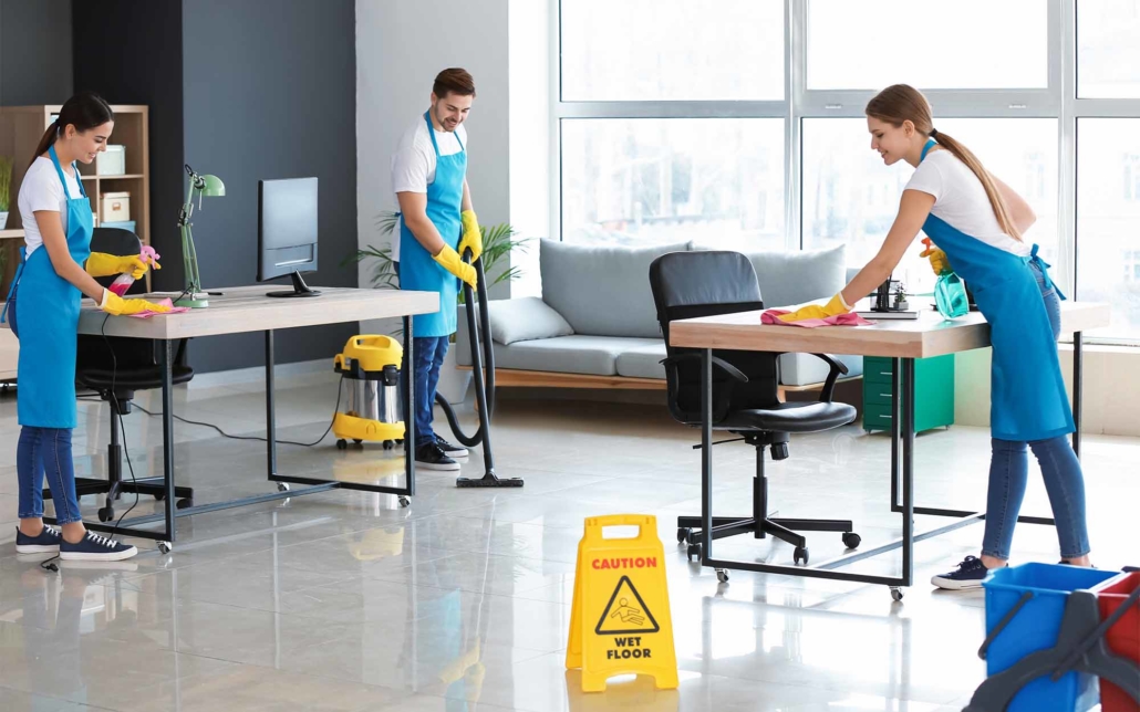 Group of cleaning workers cleaning an open office space
